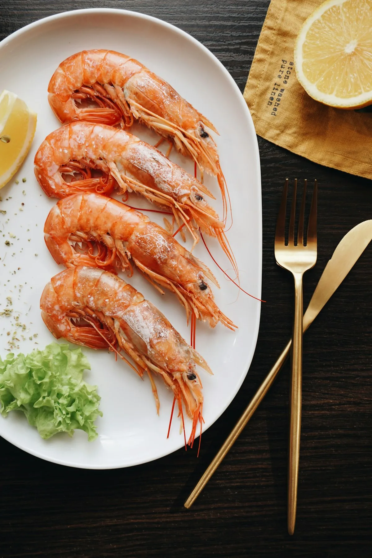 Succulent pan-seared garlic butter jumbo shrimp served atop a bed of velvety smooth cauliflower puree with chopped fresh parsley
